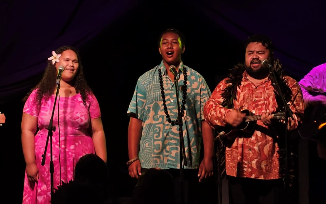 Two Cook Islands youth perform 'Mou Piri' alongside Ridge Ponini.