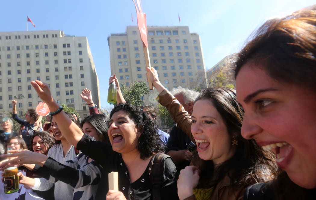Pro-abortion activists celebrate outside the constitutional court in Santiago, Chile.