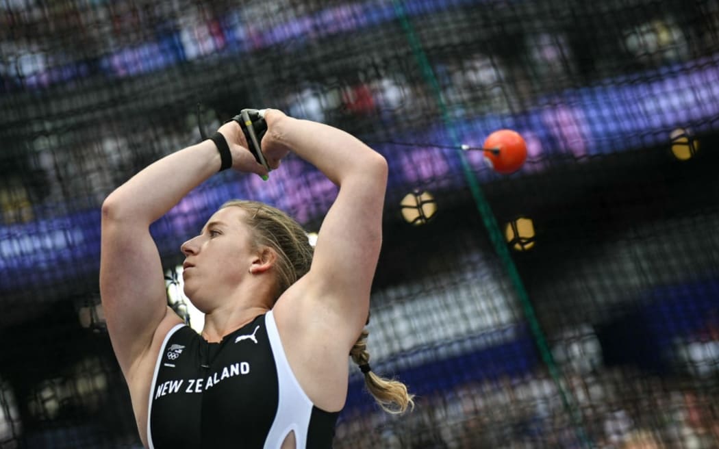 New Zealand's Lauren Bruce competes in the women's hammer throw qualification of the athletics event at the Paris 2024 Olympic Games at Stade de France in Saint-Denis, north of Paris, on August 4, 2024. (Photo by Andrej ISAKOVIC / AFP)