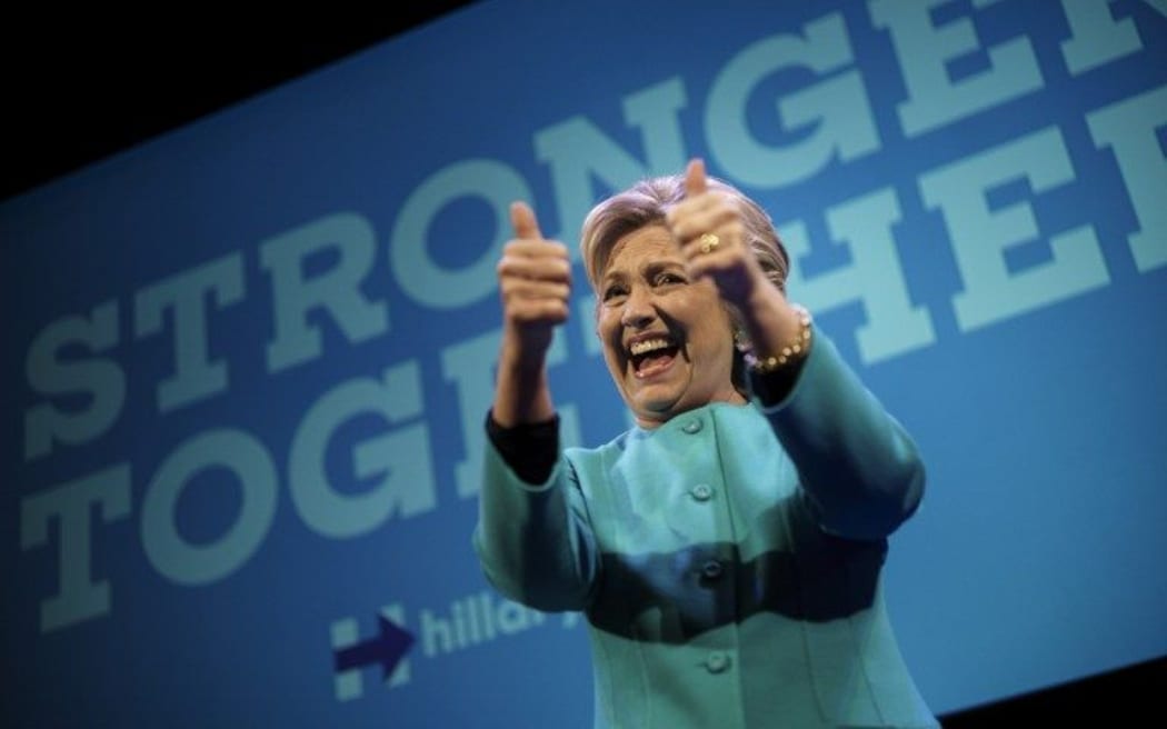 Democratic presidential nominee Hillary Clinton cheers after speaking at a fundraiser at the Paramount Theater October 14, 2016 in Seattle