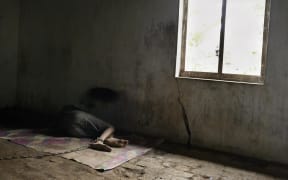 A man in shackles in Indonesia