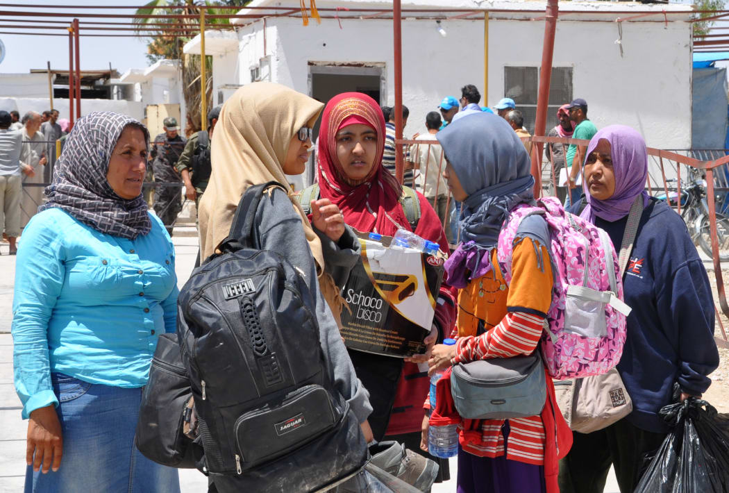 Indonesian jihadi brides arrive at a camp, after fleeing the Islamic State in Syria, in 2017.