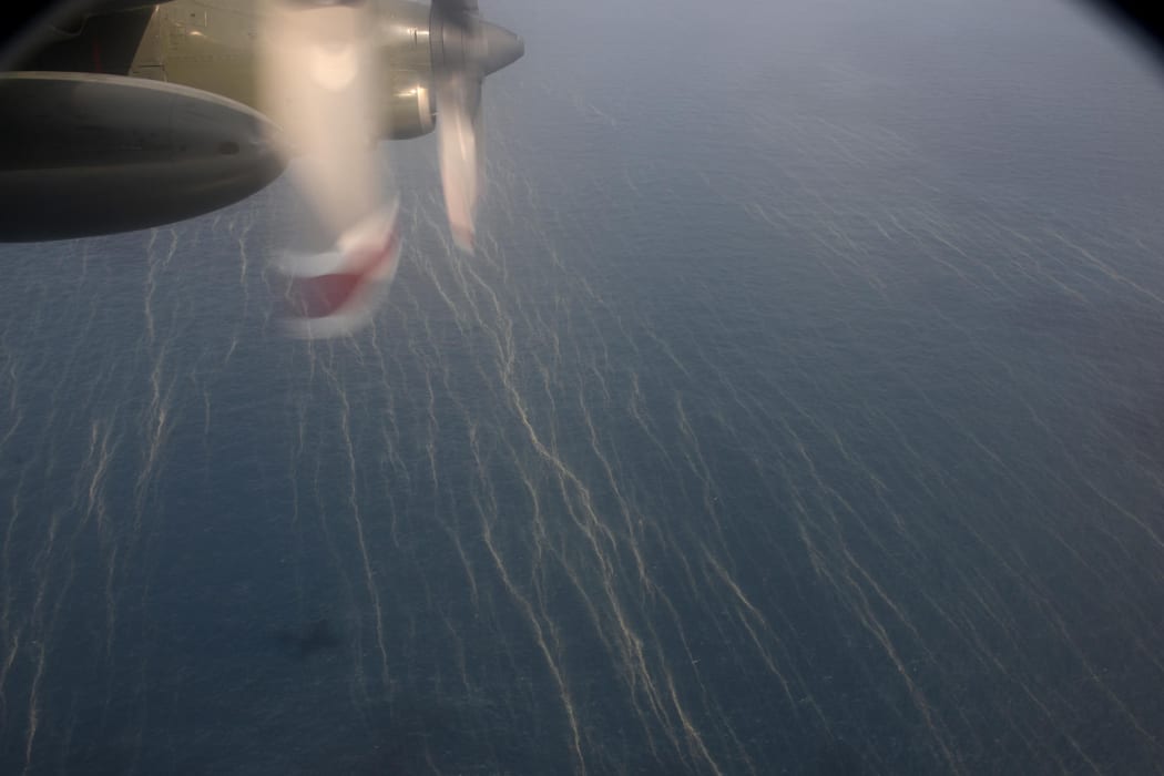Oil slicks seen from a Singapore Air Force plane scanning the sea off Kota Baru in Malaysia on Sunday.