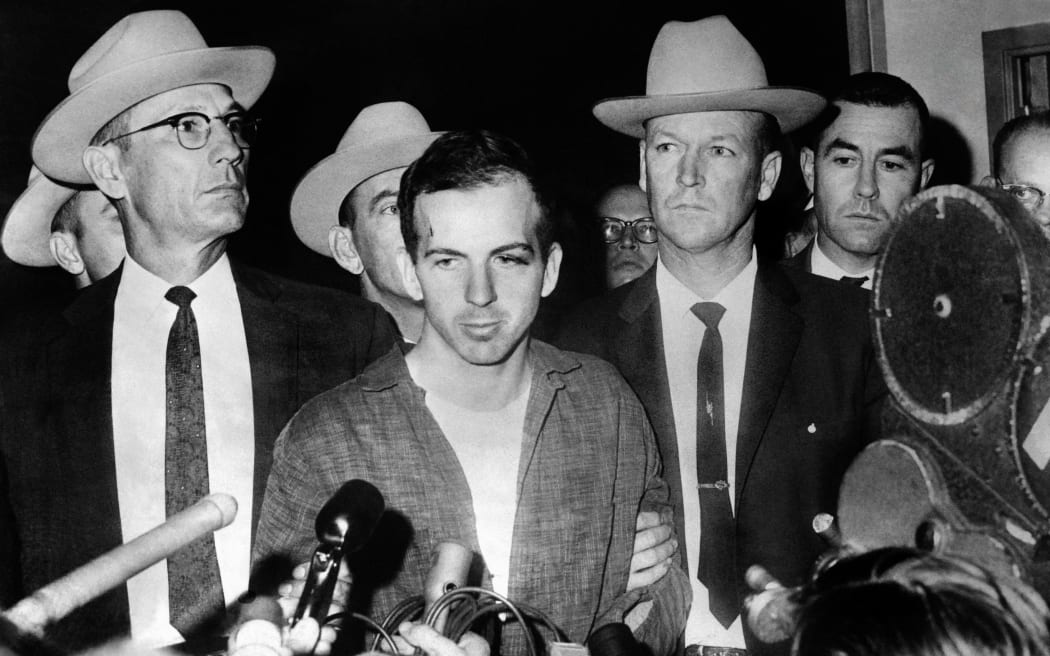 Picture dated 22 November 1963 of US President John F. Kennedy's murderer Lee Harvey Oswald during a press conference after his arrest in Dallas. Lee Harvey Oswald was killed by Jack Ruby on 24 November on the eve of Kennedy's burial. AFP PHOTO (Photo by STRINGER / AFP)