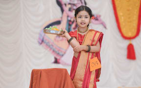 A young participant at Auckland Malayali Samajam’s Kalolsavam 2025.
