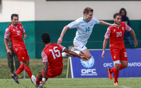New Zealand's Ben Old is tackled by Tahiti's Pothin Poma