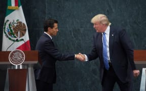 US Republican Presidential candidate Donald Trump, right, meets with Mexican President Enrique Pena Nieto.
