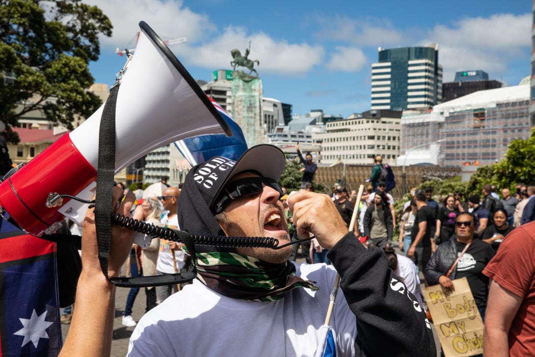 Did I mention loud? A protestor borrows someone's loud hailer to berate the front wall of the Beehive.