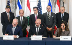 US Secretary of State Marco Rubio (C, back) looks on as (L/R, front row) Israeli Ambassador to the US Yechiel Leiter, State Department Chief of Staff Daniel Holler, and Lebanese Ambassador to the US Nada Hamadeh sign a framework agreement at the US Department of State in Washington, DC, on June 26, 2026. Lebanon, Israel and the United States on Friday signed a trilateral framework agreement aimed at paving the way for a peace deal between the two long-time Middle East adversaries. (Photo by SAUL LOEB / AFP)