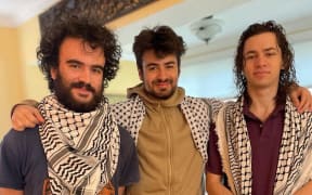 This undated handout photo provided by the Institute for Middle East Understanding shows Hisham Awartani, Tahseen Ali, and Kenan Abdulhamid, who were shot on their way to a family dinner.