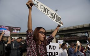 Thai protesters march against the military coup.