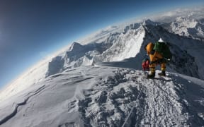 In this file photo mountaineers make their way to the summit of Mount Everest, as they ascend on the south face from Nepal.
