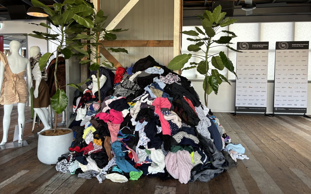 This half a tonne of unwanted clothes dumped in the middle of the Circular Fashion Awards is the amount of textile waste sent to New Zealand landfills every five minutes