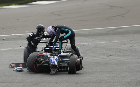 British F1 Grand Prix, Williams Racing, Alex Albon climbs out of his car after crash 2022.