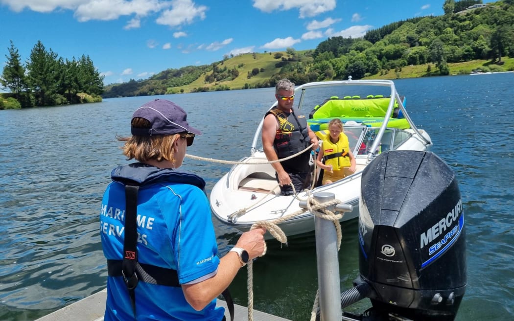 Giving a tow to a boat with engine problems at Horohoro.