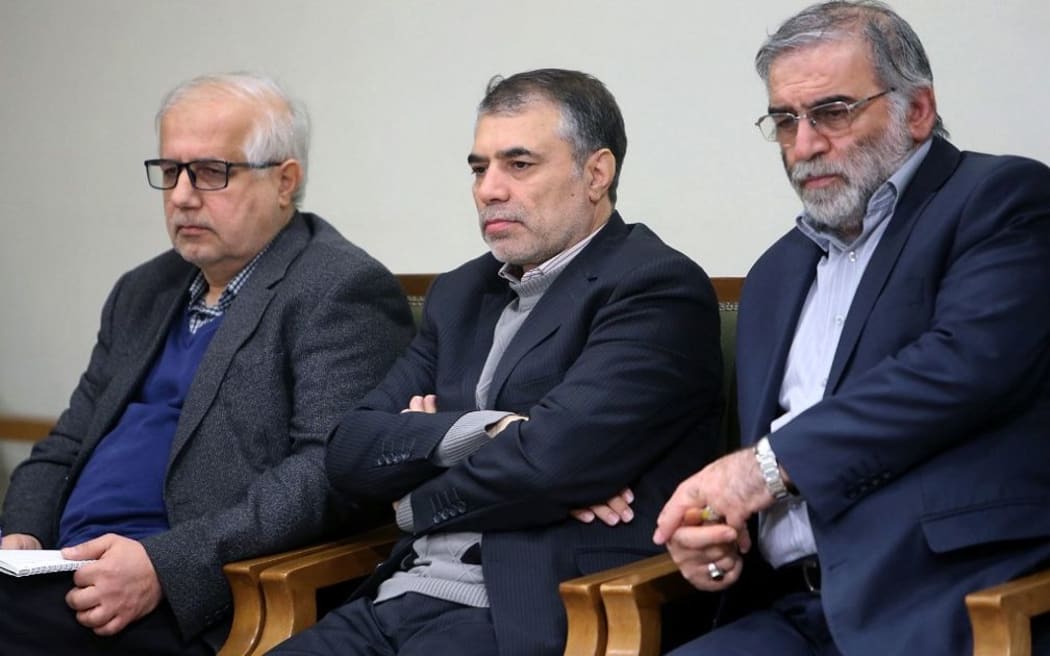 A handout picture provided by the Iranian Supreme Leader's official website on November 27, 2020, shows Iranian scientist Mohsen Fakhrizadeh (R) during a meeting with the Iranian supreme leader (unseen) in Tehran, on January 23, 2019.
