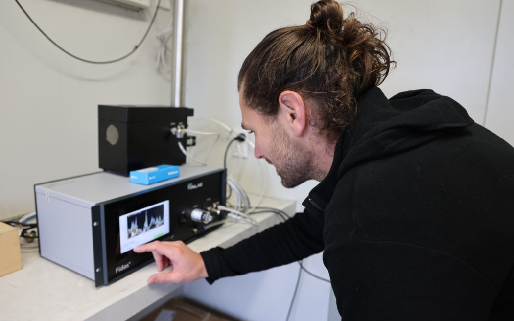 Hawke’s Bay Regional Council’s air quality scientist Jeremy Kidd checks air quality data.