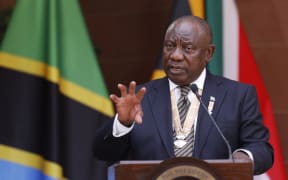 South African President Cyril Ramaphosa (R) speaks during a joint press conference withTanzanian President Samia Suluhu Hassan (not seen) during Hassan's state visit to South Africa at the Union buildings in Pretoria on March 16, 2023.
PHILL MAGAKOE / AFP
