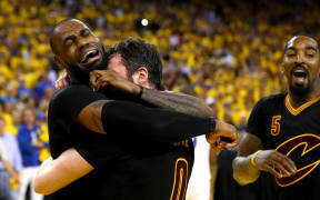 LeBron James and Kevin Love of the Cleveland Cavaliers celebrate after defeating the Golden State Warriors in the NBA final on 20 June 2016.
