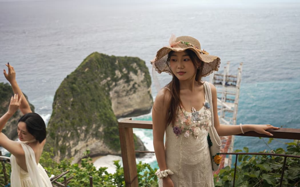 Many tourists are deterred by the 30-minute walk to the bottom of Kelingking Beach, and never reach the sand.