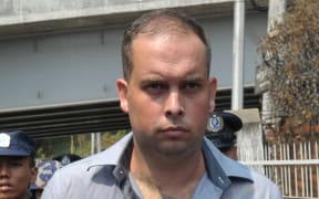 Philip Blackwood leaving court in Yangon.