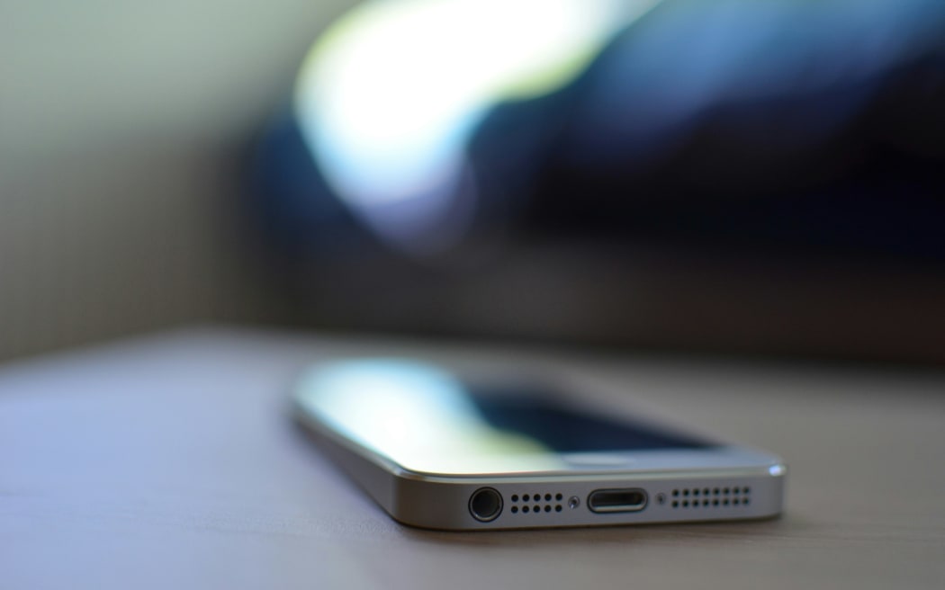 A phone on a table.