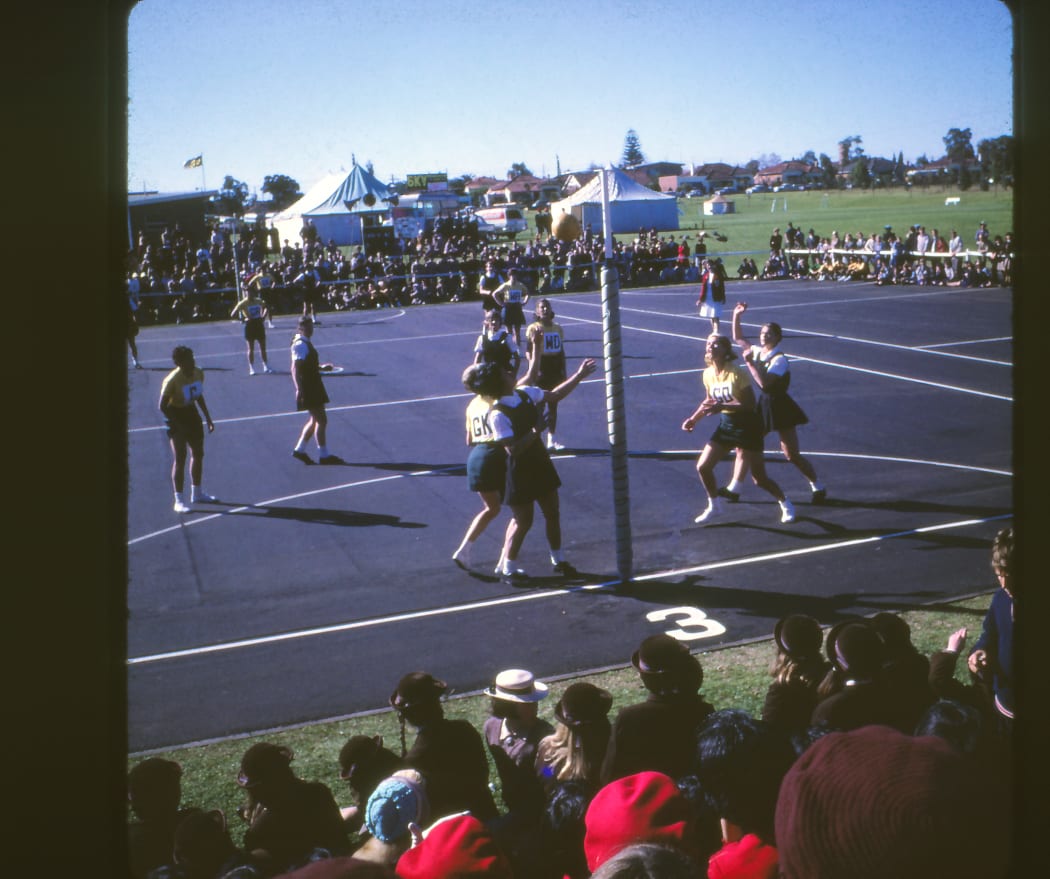 Joan Harnett shoots a goal for the Silver Ferns. Harnett played for New Zealand between 1963 and 1971.