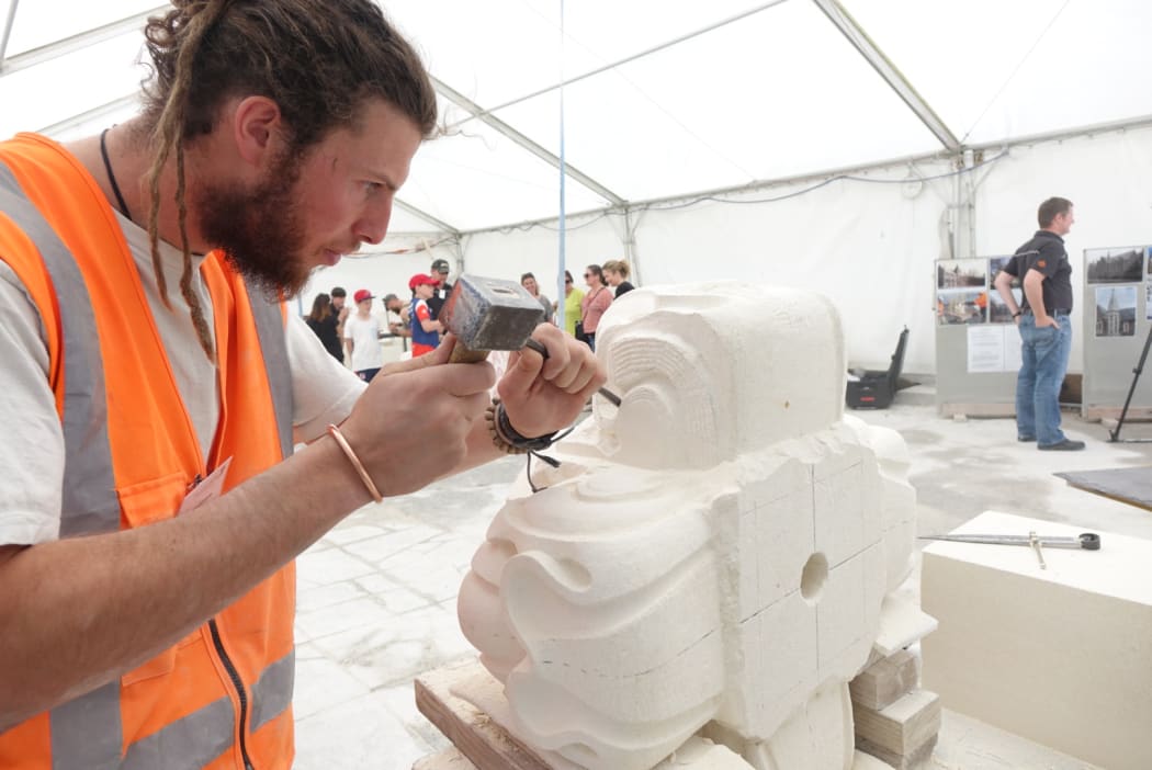 Stonemason Tristan Delpouve travelled to New Zealand to work on the $290 million restoration of the Christchurch Arts Centre.