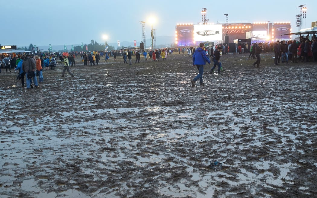 Festivalgoers walk across the site after a thunder storm at the 'Rock am Ring' (Rock at the Ring) music festival in Mendig, Germany.