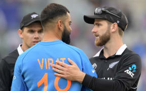 New Zealand's captain Kane Williamson speaks to India's captain Virat Kohli.