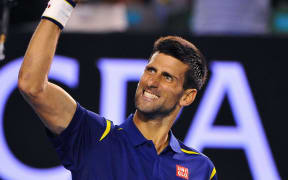 Novak Djokovic celebrates winning a point.