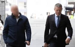 The former political figure arrives at court.