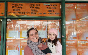 Tanya and her daughter Te Aroha at the Riddiford St polling station in Wellington, on the first day of voting.