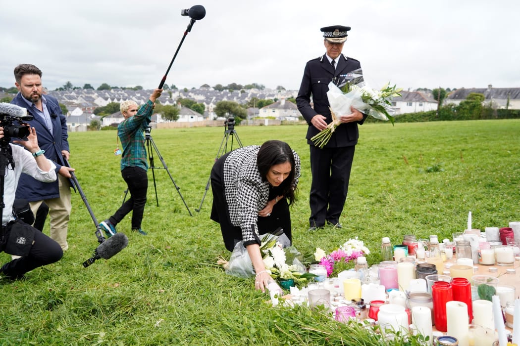 Britain's Home Secretary Priti Patel arrives to lay a floral tribute to the victims of the August 12 shootings in Plymouth, in North Down Crescent Park in the Keyham area, southwest England.