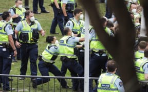 Police make multiple arrests in an effort to remove protesters occupying Parliament's precinct for a third day.
