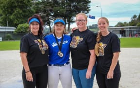 Members of the Bromhead family playing softball, from left Kyla, Tyarn, Tegan and Rebecca.