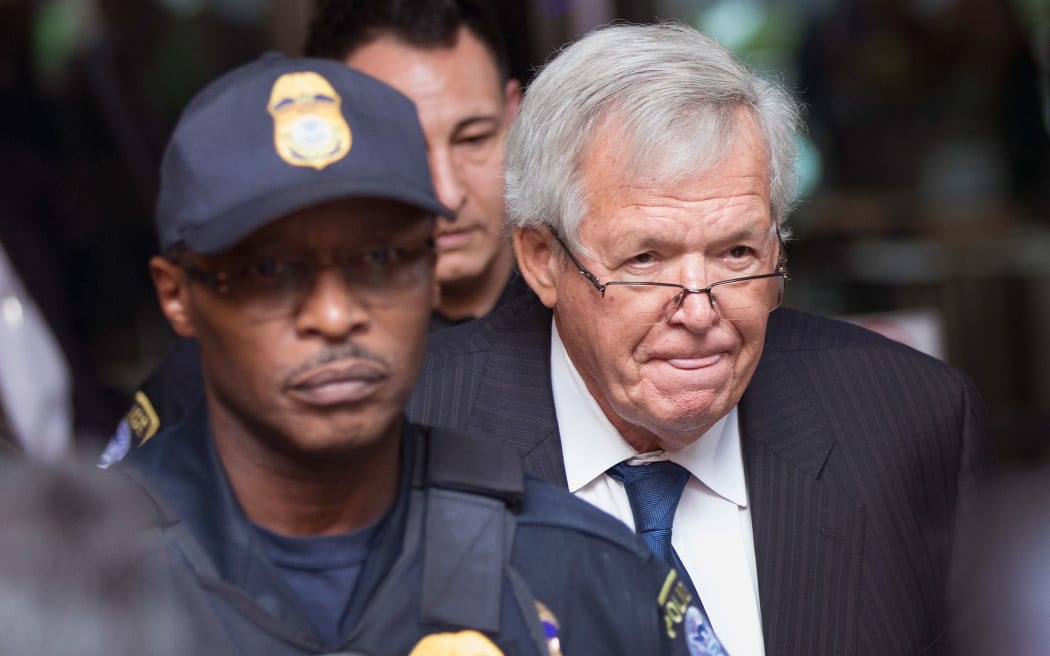 Former Republican Speaker of the House Dennis Hastert, right, leaves the Dirksen Federal Courthouse following his arraignment.