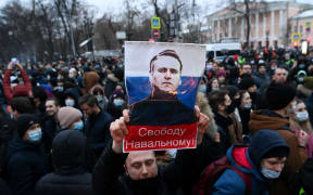 Protesters march in support of jailed opposition leader Alexei Navalny in downtown Moscow on January 23, 2021.