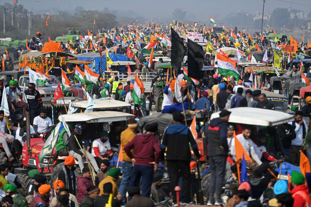 Farmers take part in a tractor rally in New Delhi on 26 January as they demonstrate against the central government's recent agricultural reforms.