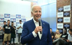 US President Joe Biden speaks to supporters and volunteers during a visit to the Roxborough Democratic Coordinated Campaign Office in Philadelphia, Pennsylvania, on July 7, 2024. Biden is back out on the campaign trail Sunday, desperate to salvage his re-election bid as senior Democrats meet to discuss growing calls that he quit the White House race. The 81-year-old Democrat kicks off a grueling week with two campaign rallies in the battleground state of Pennsylvania, before hosting the NATO leaders' summit in Washington. (Photo by SAUL LOEB / AFP)