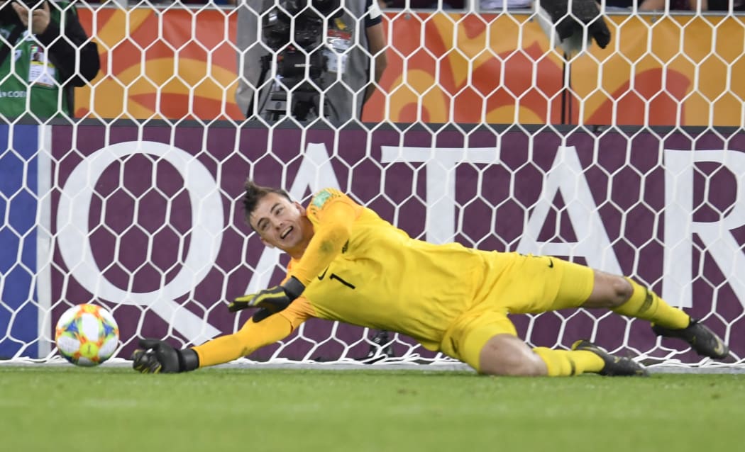 Junior All Whites goalkeeper Michael Voud makes a save during the penalty shoot out.