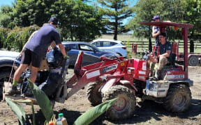 Black Caps bowler Blair Tickner (driving) and others help out with recovery efforts in Hawke's Bay in the wake of Cyclone Gabrielle.