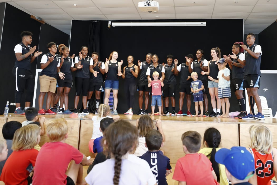 Fiji players sing a song during a school visit in Hamilton this week.