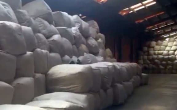 Some of the hundreds of bales of unsorted clothing at the New Lynn branch of Save Mart.