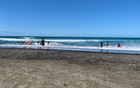 Surf lifesavers at Piha Beach