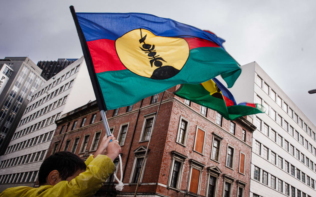 A Kanak flag raised high at the New Caledonia protest outside the French Embassy in Wellington last week. 