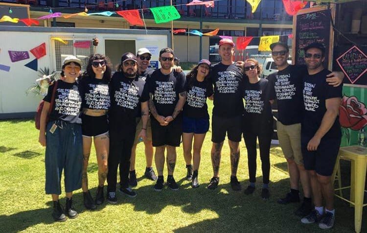 Camp Cope and other acts wearing the T-shirts they had made during the festival. Kelly wanted them to say something simple, but harsh.