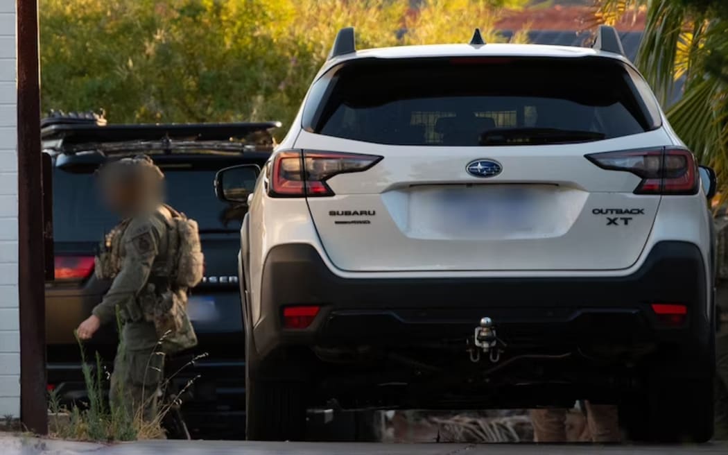 Police searching a home in Warwick as part of their investigation into an incident at an Invasion Day rally in Perth on January 26.  (ABC News: Andrew O'Connor)