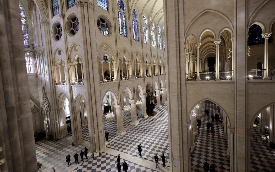 This photograph shows a general view of interior of Notre-Dame de Paris cathedral in Paris, on November 29, 2024. - The Notre-Dame Cathedral is set to re-open early December 2024, with a planned weekend of ceremonies on December 7 and 8, 2024, five years after the 2019 fire which ravaged the world heritage landmark and toppled its spire. (Photo by Christophe PETIT TESSON / POOL / AFP)