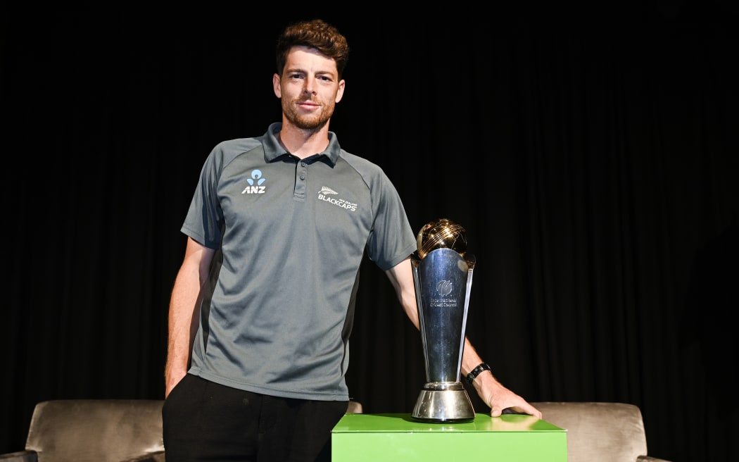 Black Caps captain Mitch Santner with the Champions Trophy.